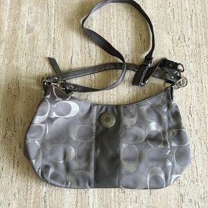 Pre owned COACH grey/ silver crossbody/hobo bag.